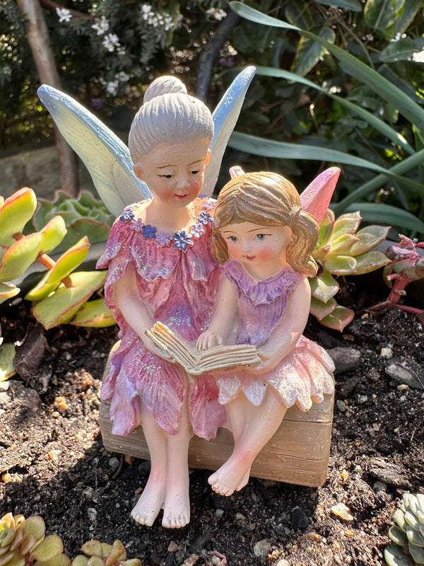 Fairy Grandmother reading with Fairy Granddaughter