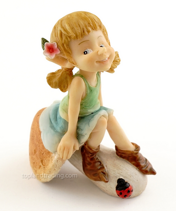 Garden pixie sitting on a mushroom image 2