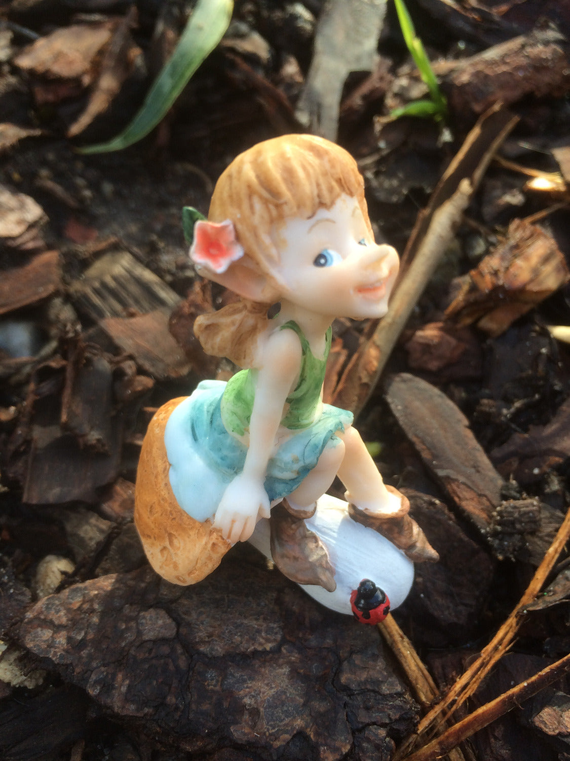 Garden pixie sitting on a mushroom image 3