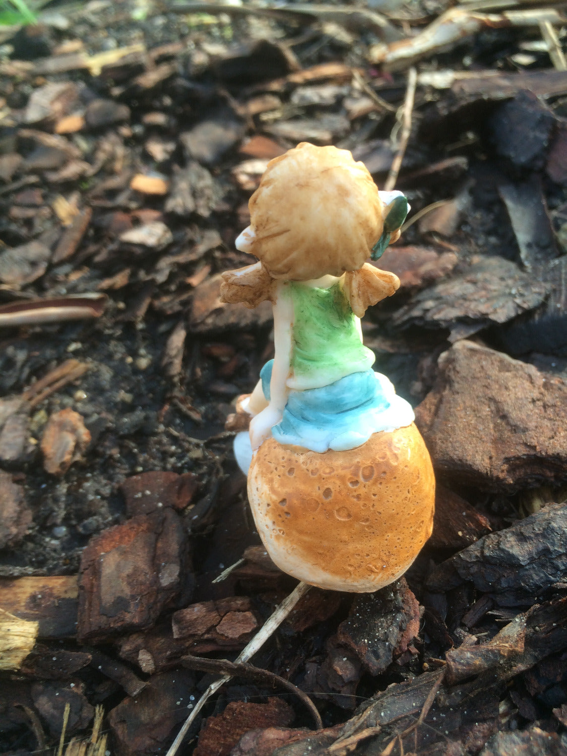 Garden pixie sitting on a mushroom image 1