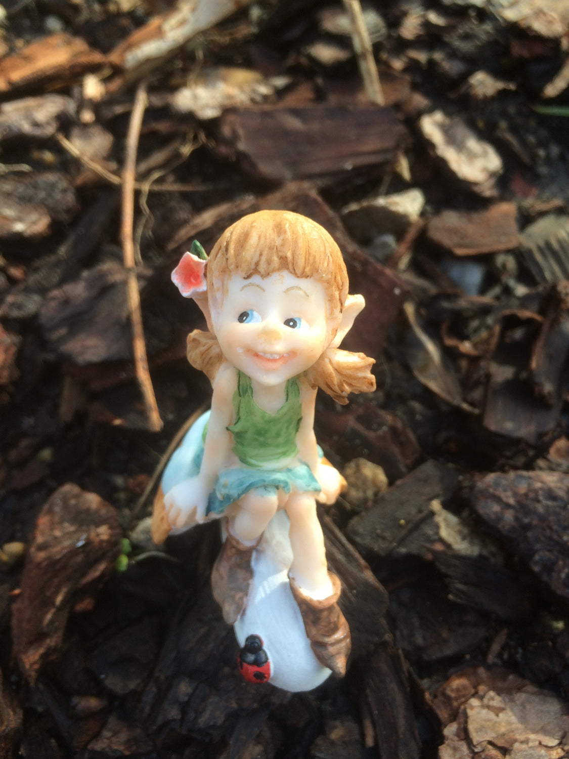 Garden pixie sitting on a mushroom image 4