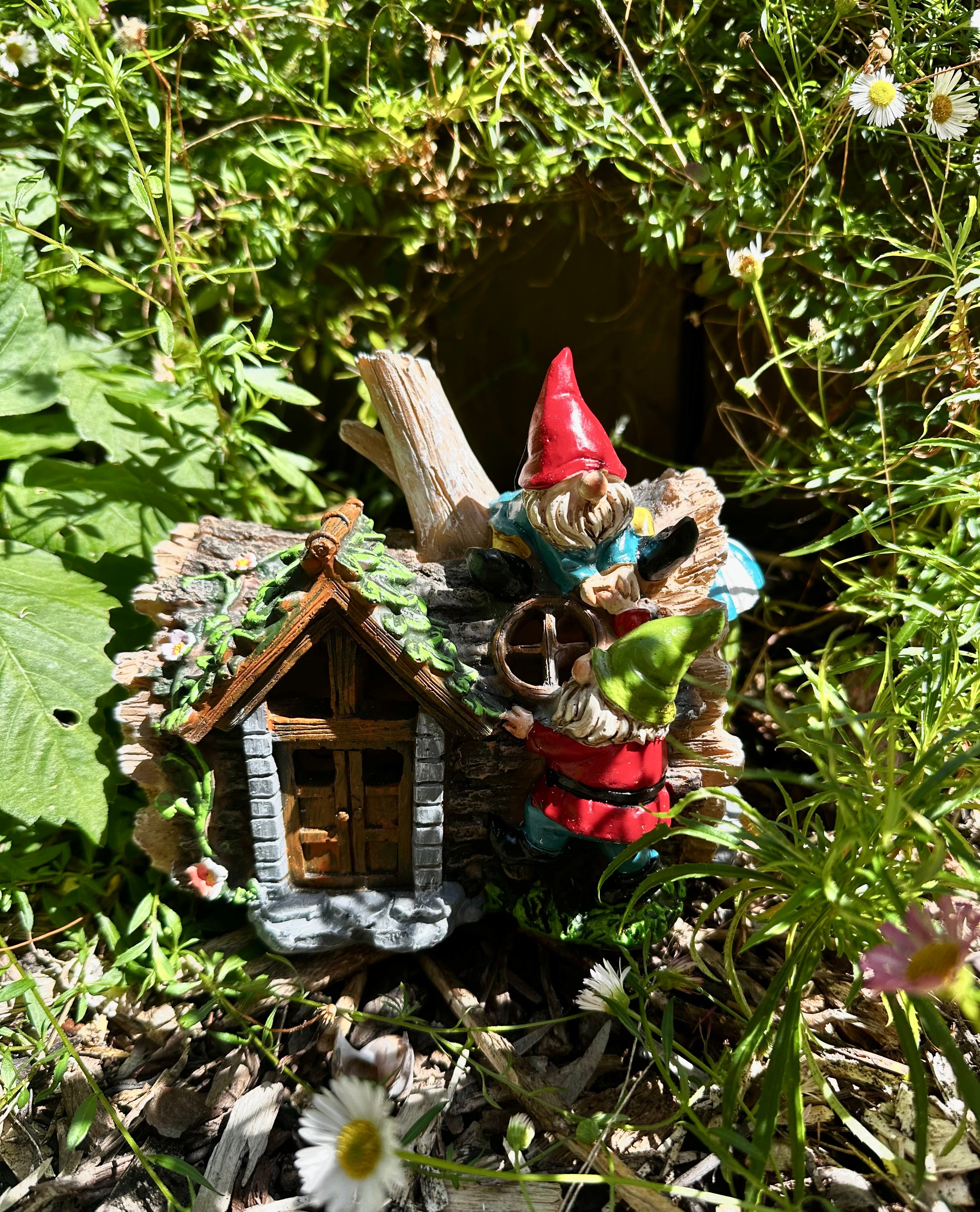 Solar gnome log cabin house