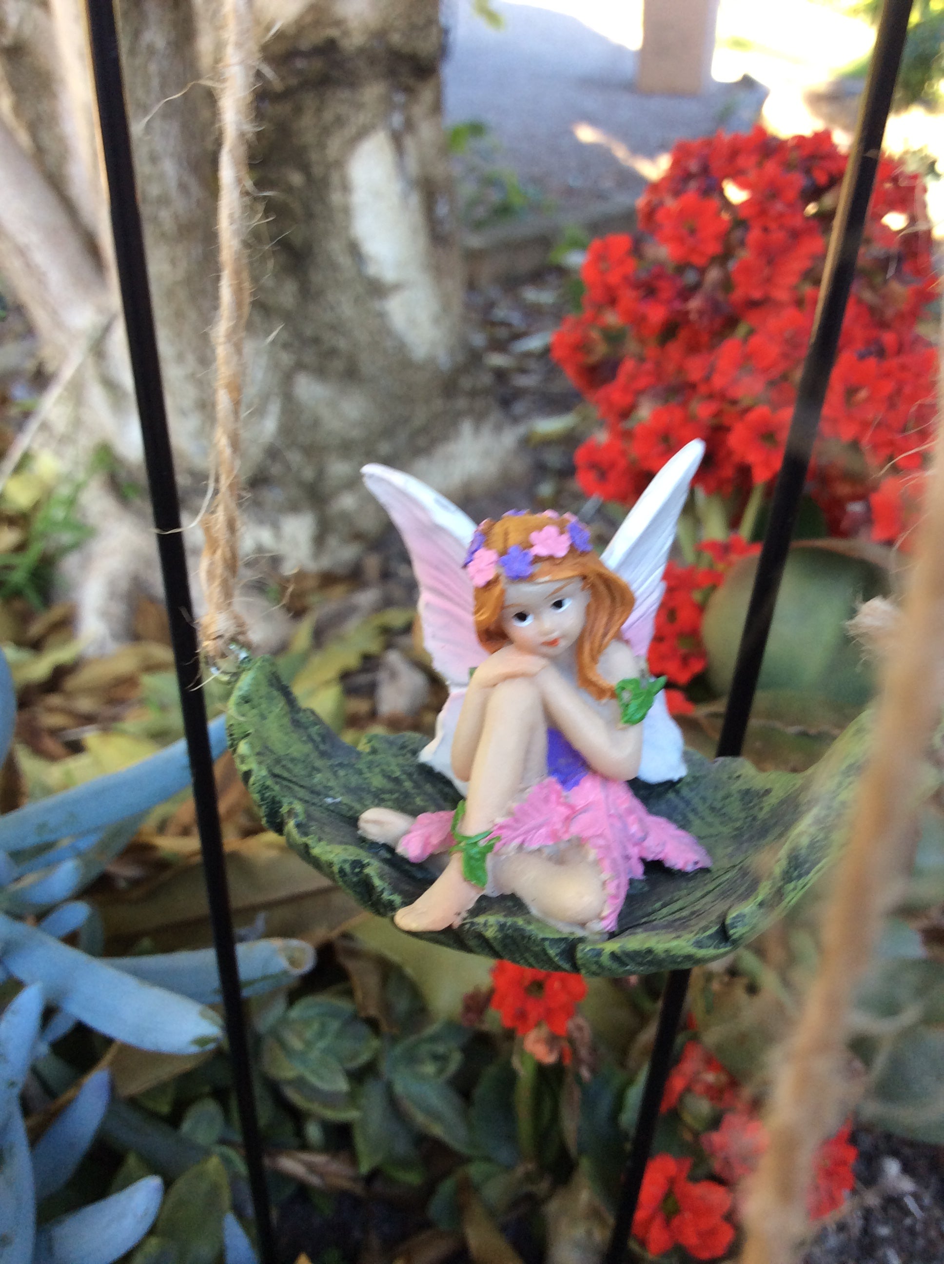 Set of 4 fairies sitting on a leaf swing with metal stake image 0